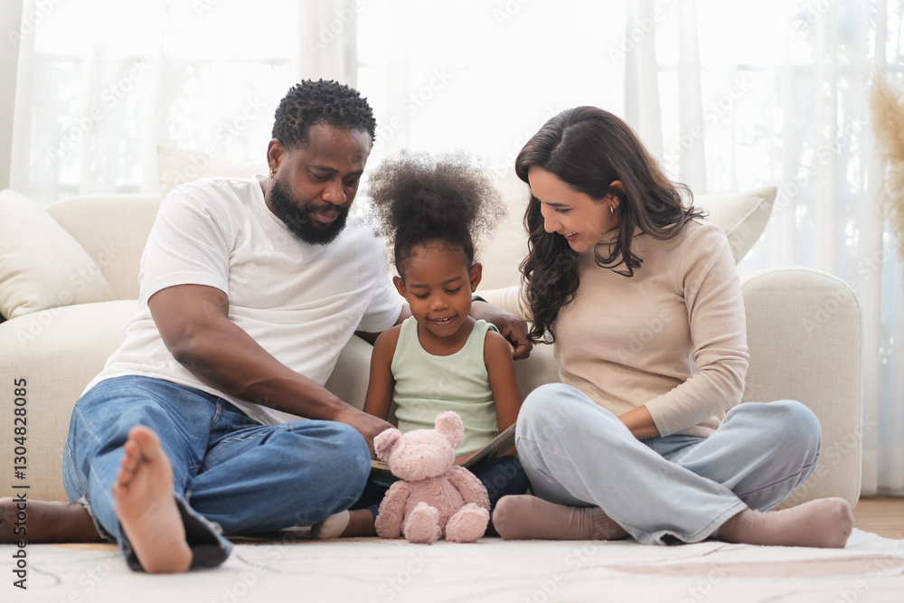 Loving interracial family sitting on floor,playing with kid in living room,bonding african kid with father and mother at home Loving interracial family sitting on floor,playing with kid in living room,bonding african kid with father and mother at home