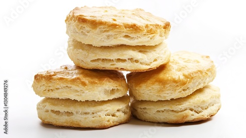 Freshly baked buttermilk biscuits arranged on a white background, showcasing their golden, flaky texture and soft interior. A delicious, comforting treat perfect for any meal or snack.