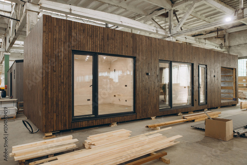 Obraz na plátně Modular wooden house under construction in a large factory