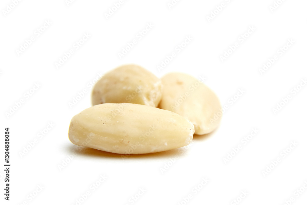 Three smooth blanched almonds arranged on a white background, highlighting their creamy texture and simplicity. Ideal for healthy food and snack concepts Three smooth blanched almonds arranged on a white background, highlighting their creamy texture and simplicity. Ideal for healthy food and snack concepts