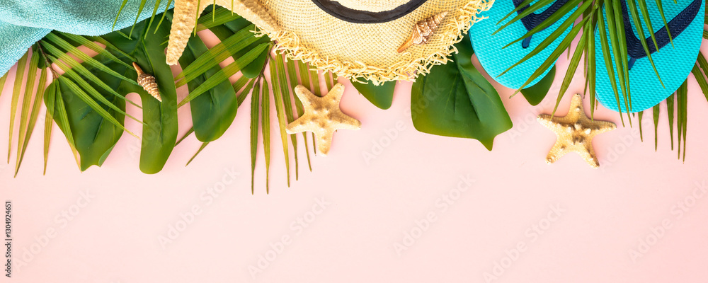 Summer flat lay background, palm leaves and clothes on pink.