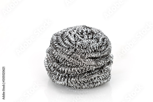 Stainless steel fiber in a ball shape is used for a pot scrubber on a white background.