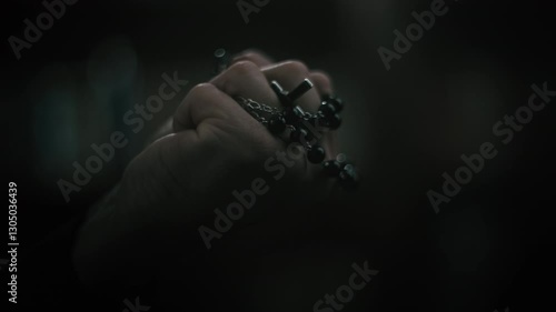 religious person with beads in hands