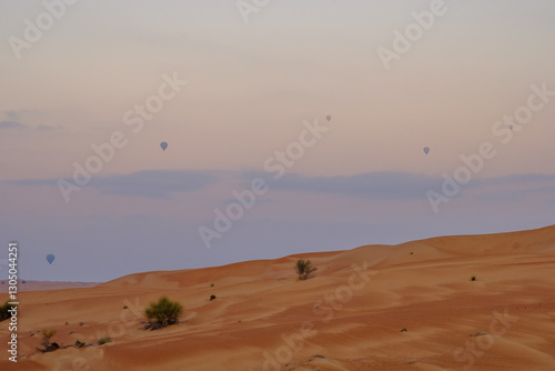 Air balloons in Dubai flying over the desert