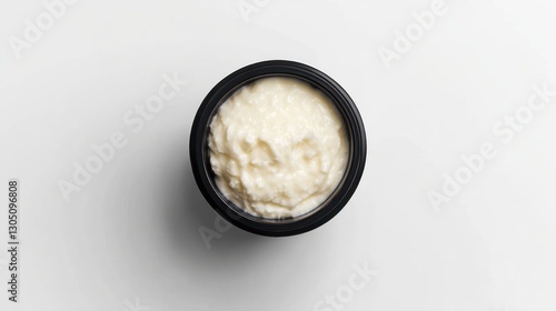 Creamy Dish in Black Bowl on White Background