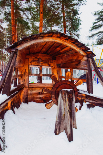 steering wheel on a wooden ship for children in the park