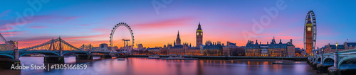 London skyline at sunset, showcasing iconic landmarks and bridges.