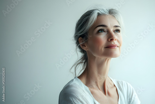 Happy Mature woman portrait with short grey hair isolated on white background