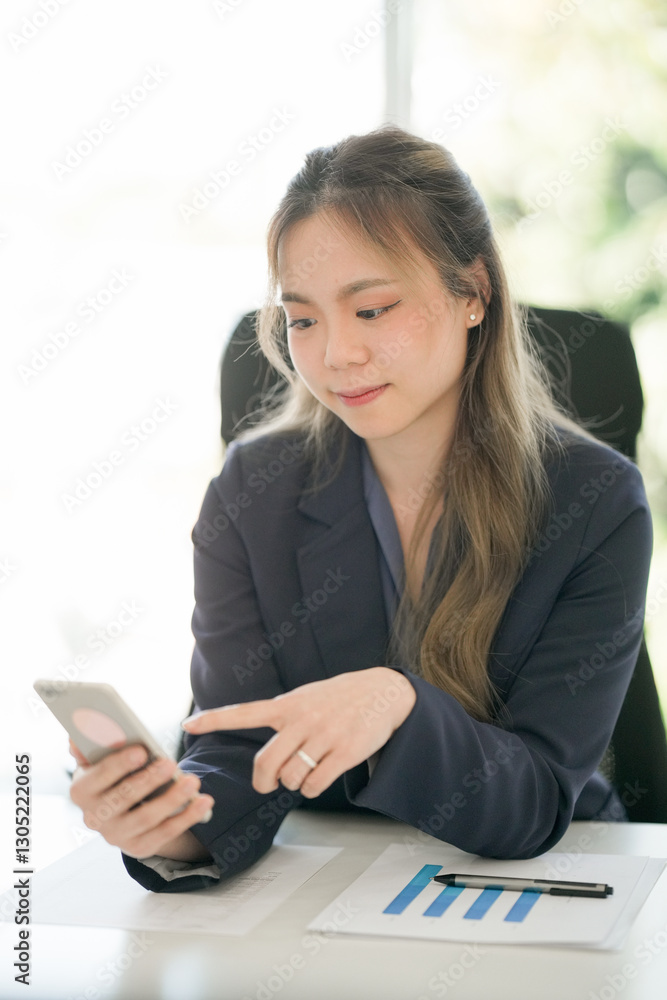 Portrait of confident Asian business woman working in office Portrait of confident Asian business woman working in office