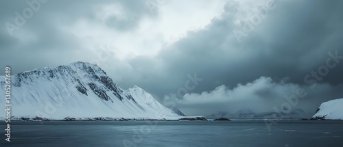 Wallpaper Mural Dramatic snowy mountain landscape with ominous stormy cloudy sky in remote arctic wilderness  Powerful majestic and moody scenic view of rugged Torontodigital.ca