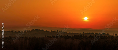 Obraz na płótnie Sunset over mountains on the horizon. w salonie