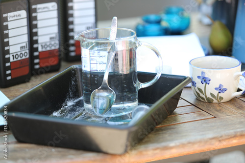 Objects for analog film development, including reels, tanks, chemicals, and darkroom tools. Concept of traditional photography, darkroom process, and film photography workflow.