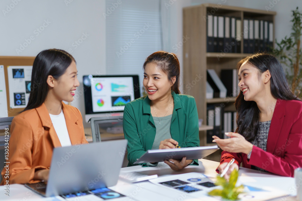 Professional Asian women collaborating during meeting, working on laptop and tablet, sharing ideas with enthusiasm at modern office desk, smiling and connecting Professional Asian women collaborating during meeting, working on laptop and tablet, sharing ideas with enthusiasm at modern office desk, smiling and connecting