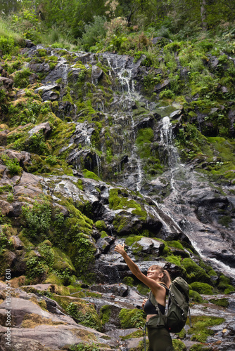Obraz na płótnie Woman Tourist Taking Selfie Picture by Waterfall w salonie
