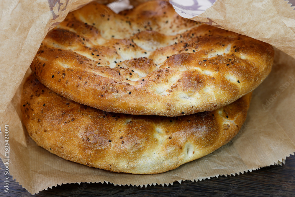 Pide - Turkis pita on rustic wood background Pide - Turkis pita on rustic wood background