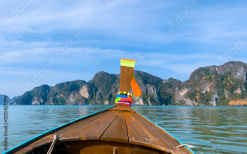 Scenic view of maya bay Thailand from traditional longtail boat photo