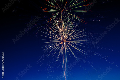 The moment of a firework explosion in the sky. This picture was taken with a long exposure, which captured the beauty and surprising shapes of the festive fireworks.
