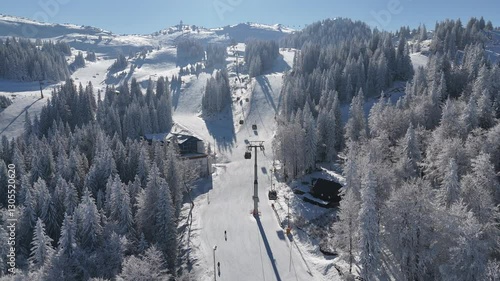 Aerial video on the ski slopes, people skiing at a ski resort