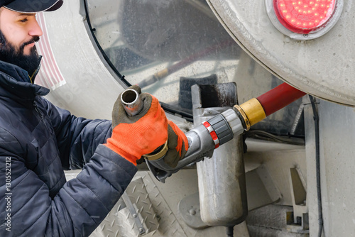 Winter is a busy season for the Heating Oil Delivery Business. Driver with his salt covered truck brings oil to our home in Windsor in Upstate NY.