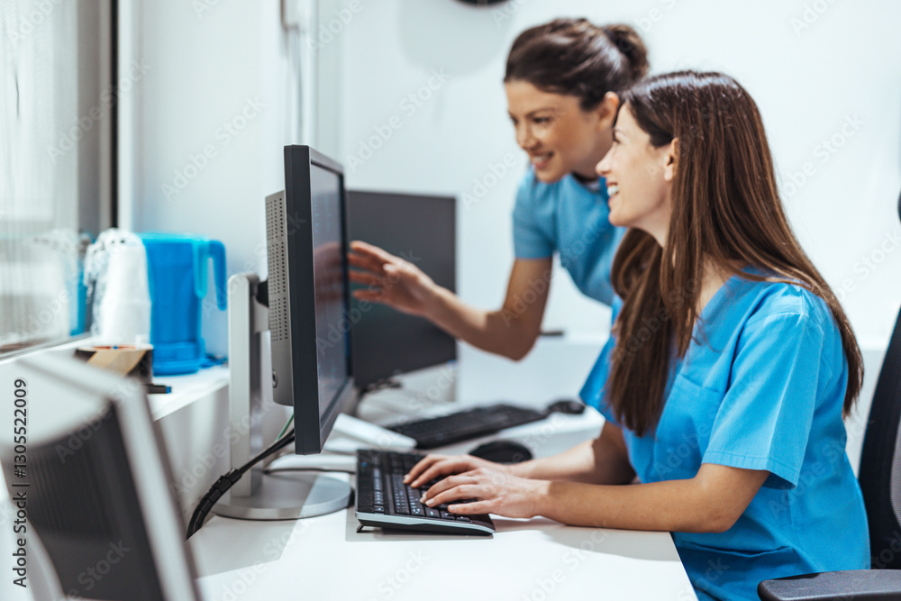 Professional Medical Staff Collaborating on Computer Screens in a Clinic Professional Medical Staff Collaborating on Computer Screens in a Clinic