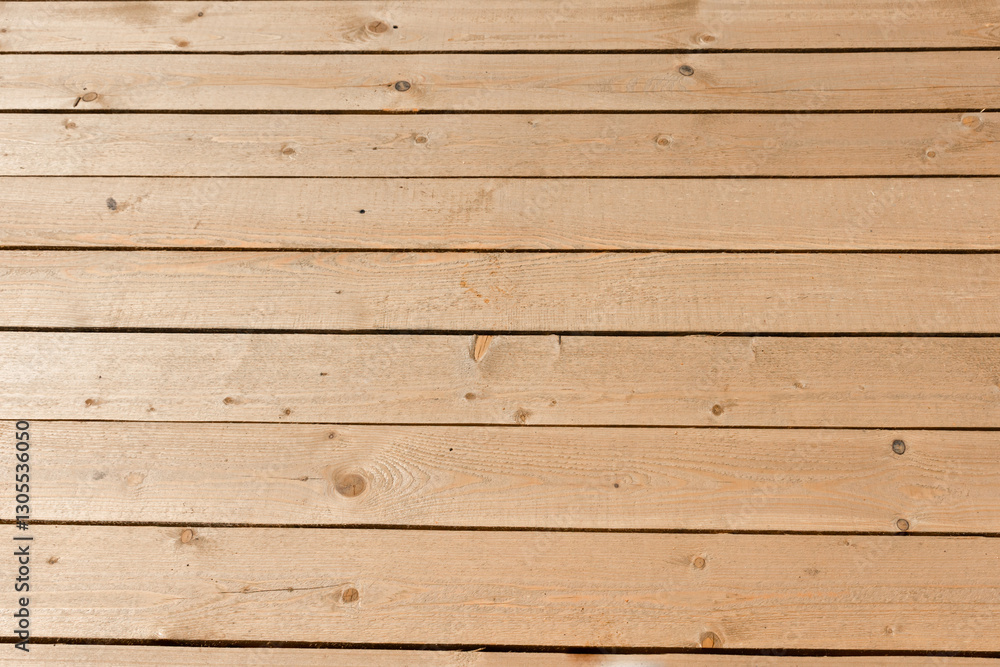 Obraz premium Temporary wooden flooring for moving around the territory. The flooring is made of untreated wooden planks on the street.