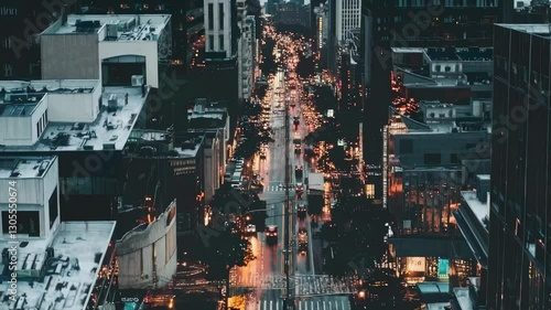 Wallpaper Mural Aerial view of a bustling city street at dusk, showcasing vibrant lights and traffic. The video captures the urban atmosphere from a high angle. Torontodigital.ca