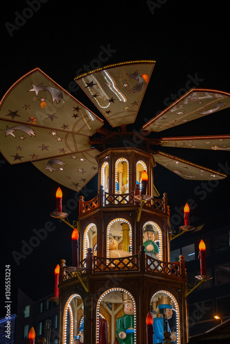 Night photo of a traditional Christmas Pyramid at a Munich, Germany Christmas market