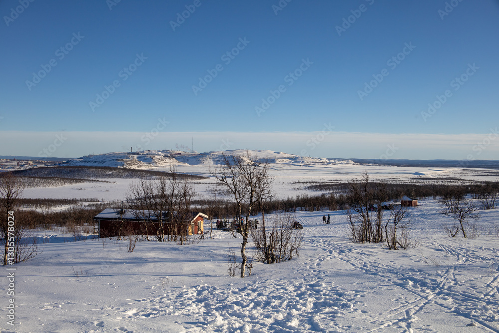 Stunning sunset view over Kiruna city and mine with snow covered trees in Swedish Lapland Stunning sunset view over Kiruna city and mine with snow covered trees in Swedish Lapland