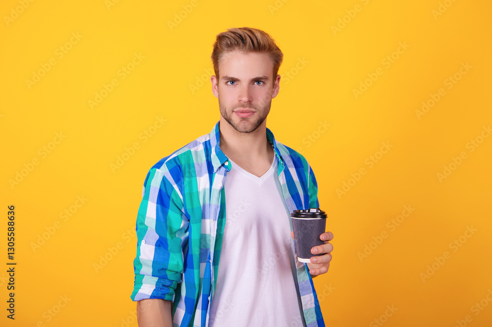 Man drinking tea. Warm morning. Coffee break at home. Millennial man having coffee cup isolated on yellow. Morning coffee time. Lifestyle concept. Drinking espresso Man drinking tea. Warm morning. Coffee break at home. Millennial man having coffee cup isolated on yellow. Morning coffee time. Lifestyle concept. Drinking espresso
