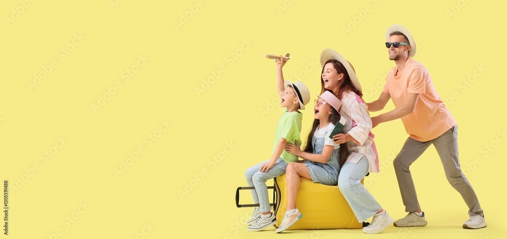 Fototapeta premium Happy family with suitcase on yellow background with space for text. Travel concept