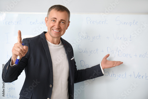 Male teacher conducting Eng...