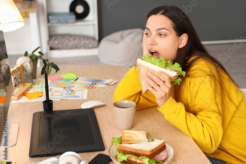 Young woman eating tasty sa...