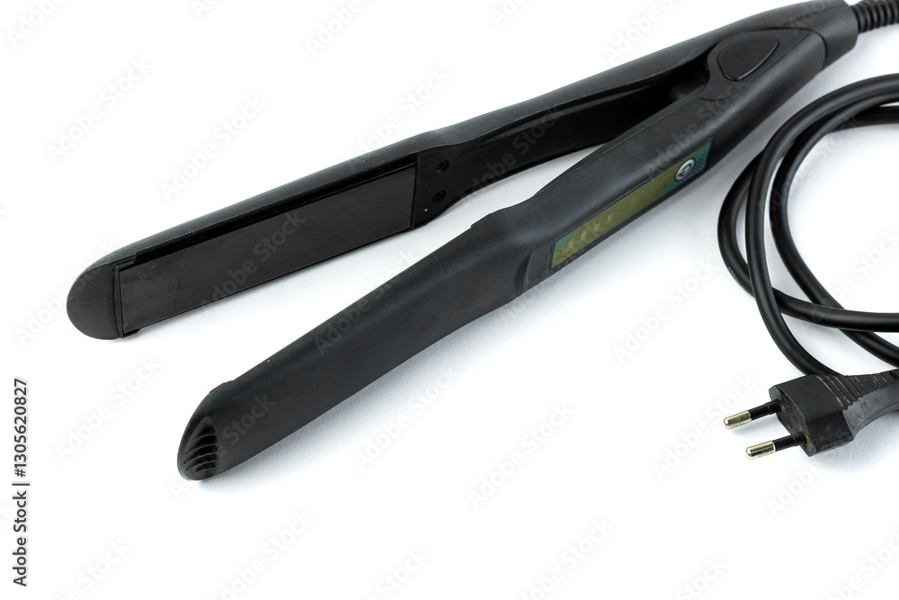 Obraz premium Professional black hair straightener with ceramic plates for smooth and sleek hair. Features fast heating, ergonomic grip, and a swivel cord for easy styling at home or in salons.