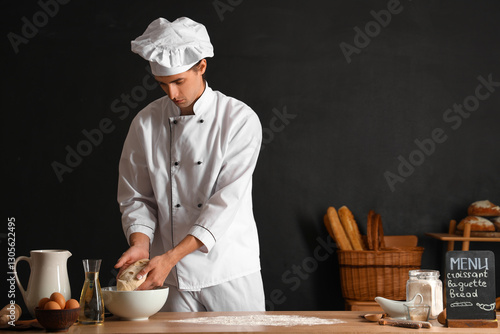 Handsome young chef with ra...