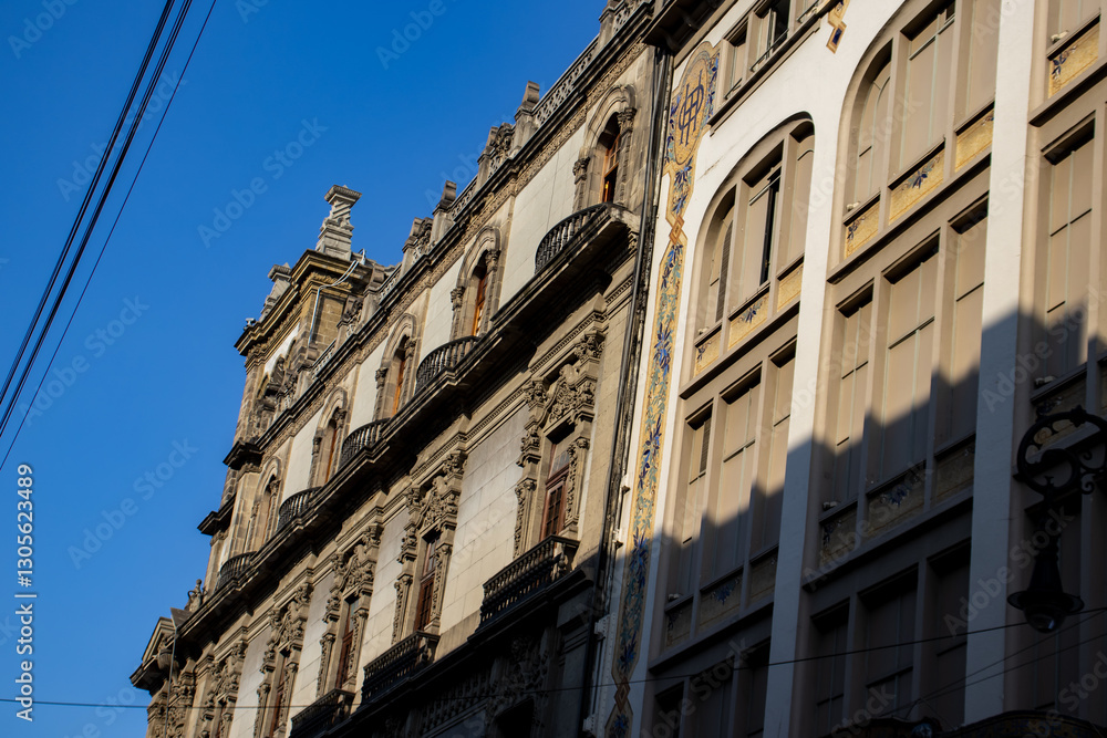 Detail of the beautiful architecture of the historical buildings at Mexico City downtown. Detail of the beautiful architecture of the historical buildings at Mexico City downtown.