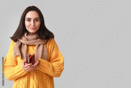 Young woman in yellow sweat...