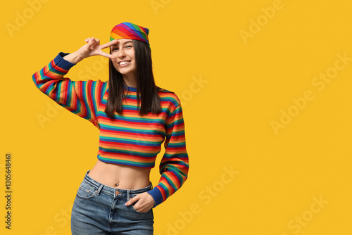 Young happy woman in rainbo...