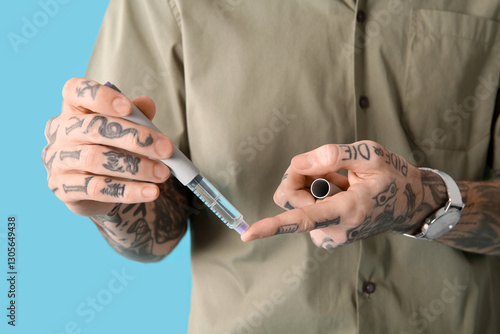 Diabetic young man using la...