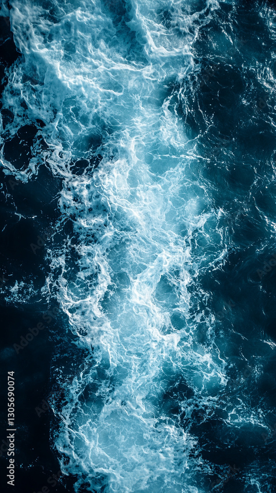 Aerial drone view of crystal-clear sea waves crashing onto a dark navy blue or gray sandy beach, showcasing the beauty of nature and the contrast between water and earth.
Aerial drone view of crystal-clear sea waves crashing onto a dark navy blue or gray sandy beach, showcasing the beauty of nature and the contrast between water and earth.