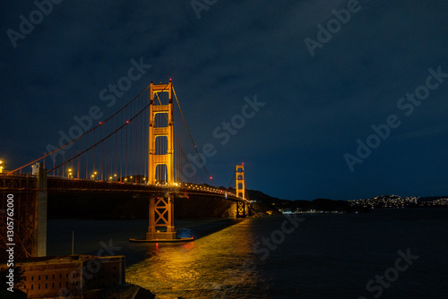 Golden Gate Bridge Illuminated at Night Against the San Francisco Skyline