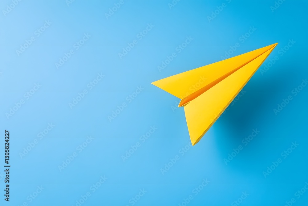 Bright Yellow Paper Airplane Soaring Gracefully Against a Clear Blue Sky for Fun and Creativity Bright Yellow Paper Airplane Soaring Gracefully Against a Clear Blue Sky for Fun and Creativity