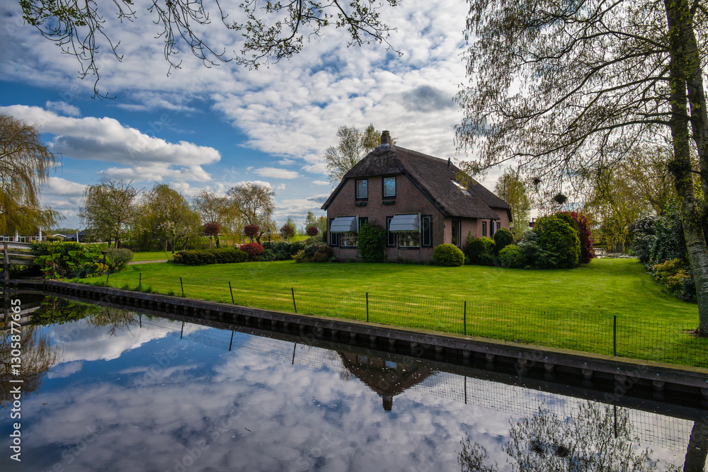 Giethoorn Netherlands, city skyline at canal and traditional house in Giethoorn village