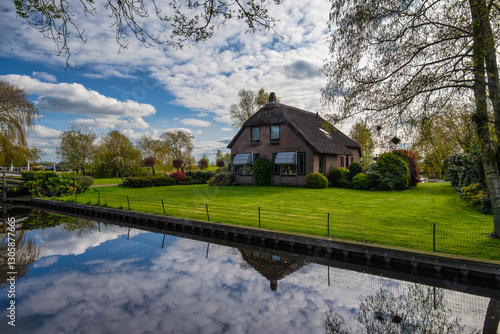 Giethoorn Netherlands, city skyline at canal and traditional house in Giethoorn village