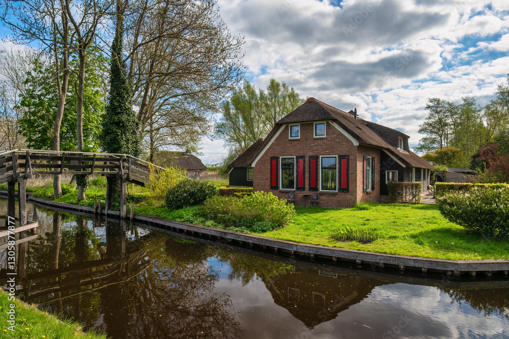 Giethoorn Netherlands, city skyline at canal and traditional house in Giethoorn village