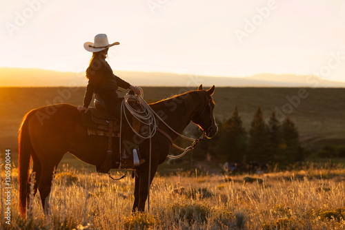Colorado Cowgirl riding in Mountain ranch on Quarter Horse
