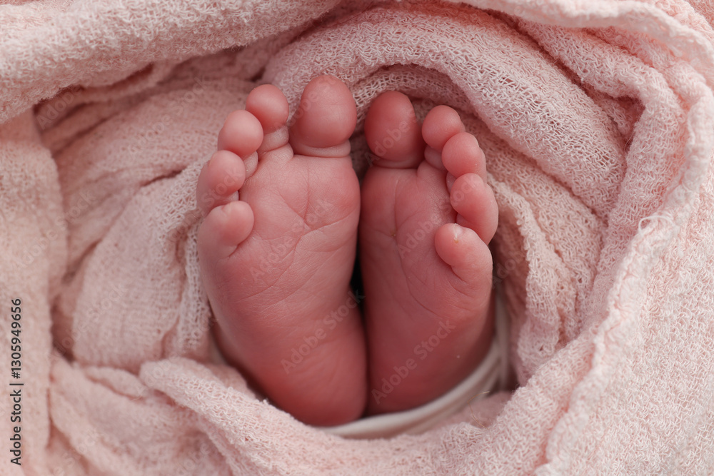 Baby foot on pink soft coverlet, blanket.Close-up of tiny, cute, bare toes, heels and feet of a newborn girl, boy.Detail of a newborn baby legs. Macro horizontal professional studio photo. Baby foot on pink soft coverlet, blanket.Close-up of tiny, cute, bare toes, heels and feet of a newborn girl, boy.Detail of a newborn baby legs. Macro horizontal professional studio photo.