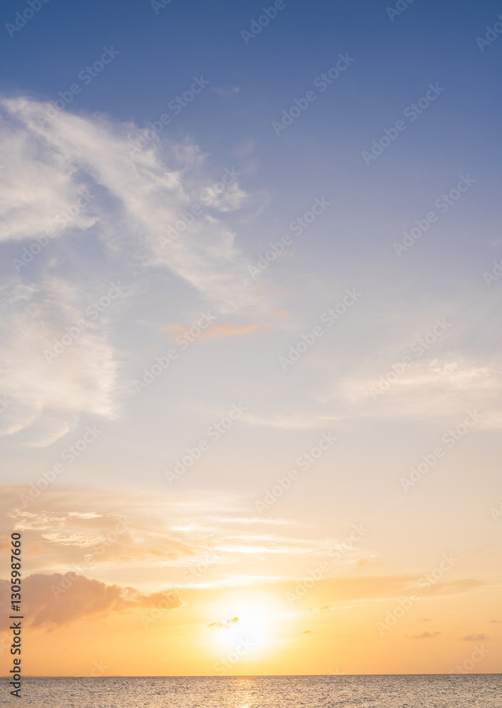Sunset sky vertical in the morning with blue and orange, yellow sunrise and clouds fluffy, Horizon sea golden hour summer Background Sunset sky vertical in the morning with blue and orange, yellow sunrise and clouds fluffy, Horizon sea golden hour summer Background