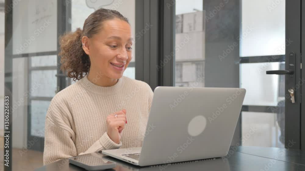 Multiracial Woman Doing Video Chat via Laptop Multiracial Woman Doing Video Chat via Laptop