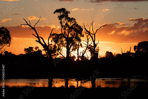 Sunset in country Victoria. Magical orange sky and reflection in the water. photo