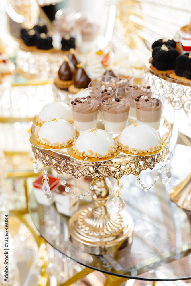 Fototapeta premium Delicious macarons and pastries decorating a luxurious candy bar buffet